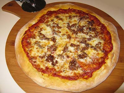 Pizza with Sausage and Anchovies